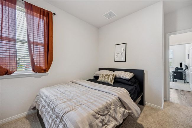 Carpeted bedroom with baseboards | Image 33