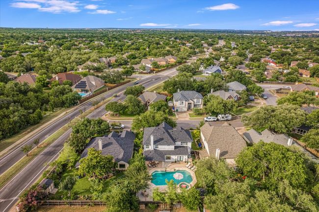 View of property location with nearby suburban area and a pool area | Image 35