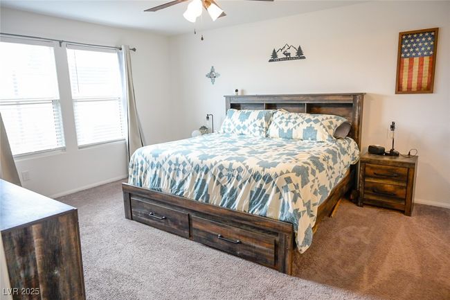 Carpeted bedroom featuring baseboards and a ceiling fan | Image 18