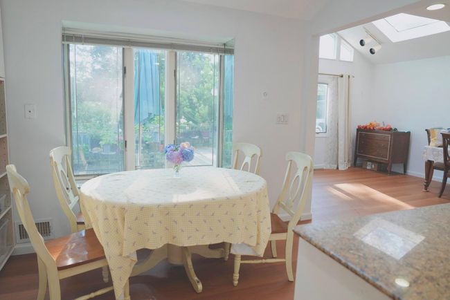 Eat-in Break area featuring vaulted ceiling, a skylight, and plenty of natural light | Image 7