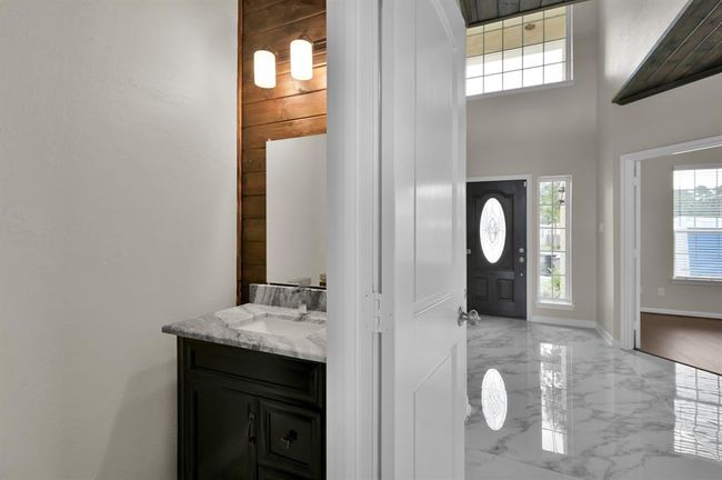 Half bath near the front, Office and Dining Room | Image 11