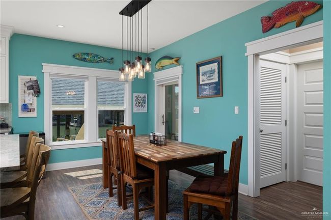 Dining space featuring dark hardwood / wood-style floors | Image 5