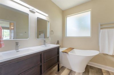 Primary bath with slipper tub, heated towel rack, shower, and double vanity | Image 1