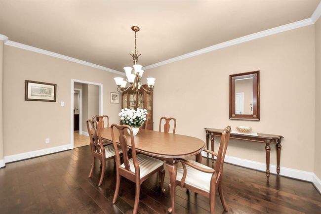 Formal Dining room could easily transform into a nice sitting room with lounge chairs, coffee table and delicious beverages! | Image 6