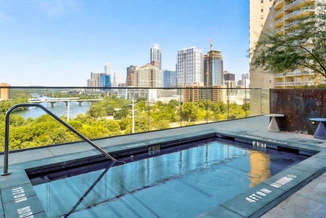 View of swimming pool featuring a city view | Image 20