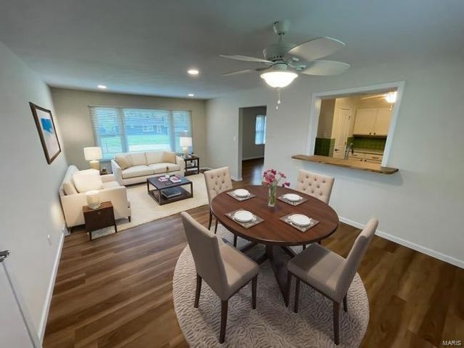 Dining space with recessed lighting, a ceiling fan, wood finished floors, and baseboards | Image 7