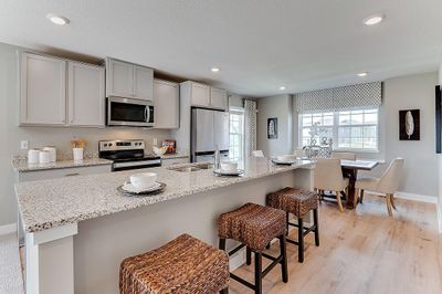 Kitchen and dining flow nicely in this open concept plan. Model home, details will vary. | Image 2