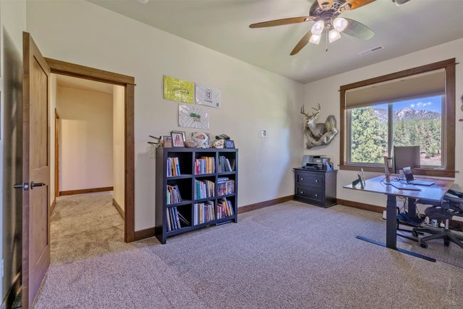 Office area featuring carpet floors, baseboards, and ceiling fan | Image 36