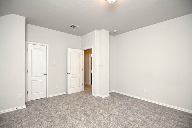 Unfurnished bedroom with baseboards, visible vents, and carpet | Image 31
