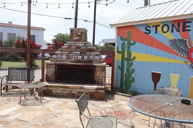 View of patio / terrace with an outdoor stone fireplace | Image 31