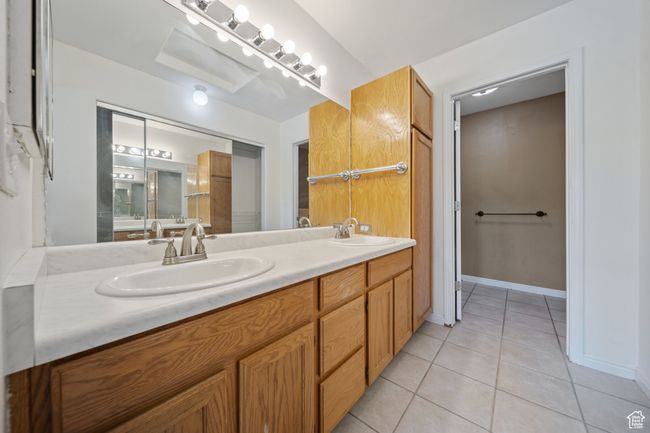 Bathroom featuring tile patterned flooring and double vanity | Image 18