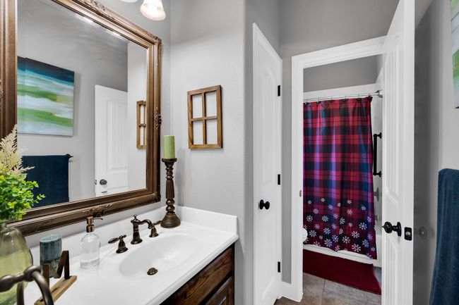 Bathroom with tile patterned floors and vanity | Image 23