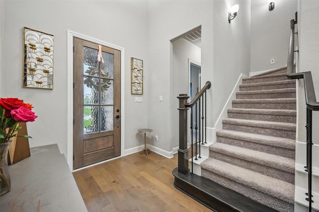 Foyer entrance featuring wood finished floors and stairway | Image 4