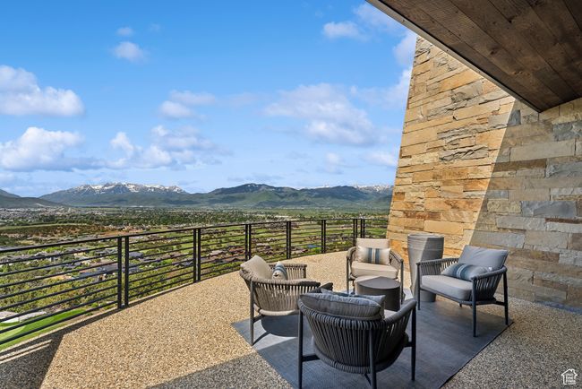 View of patio with a mountain view and outdoor lounge area | Image 104