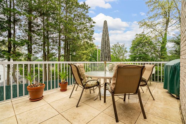 View of patio / terrace featuring a balcony, grilling area, and outdoor dining area | Image 47