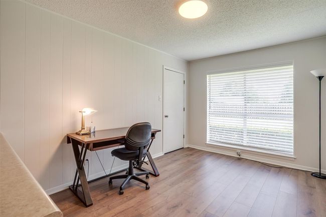 Office space with a textured ceiling and wood finished floors | Image 20
