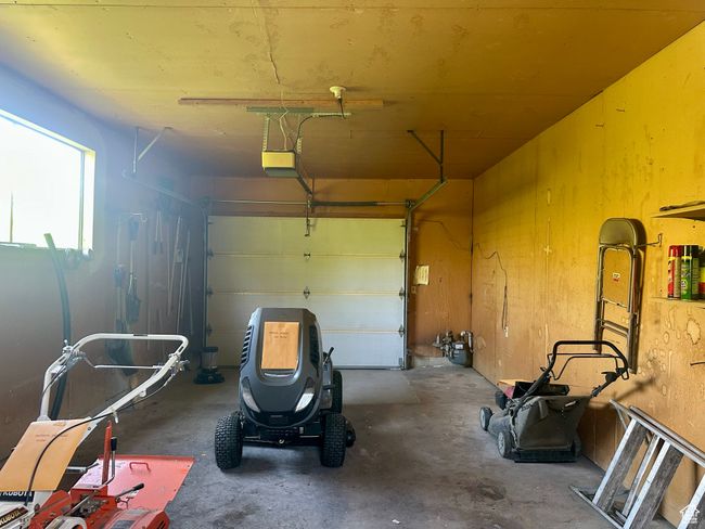 Garage with a garage door opener | Image 25