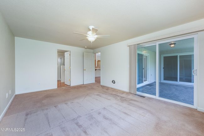 Primary bedroom with patio access | Image 13