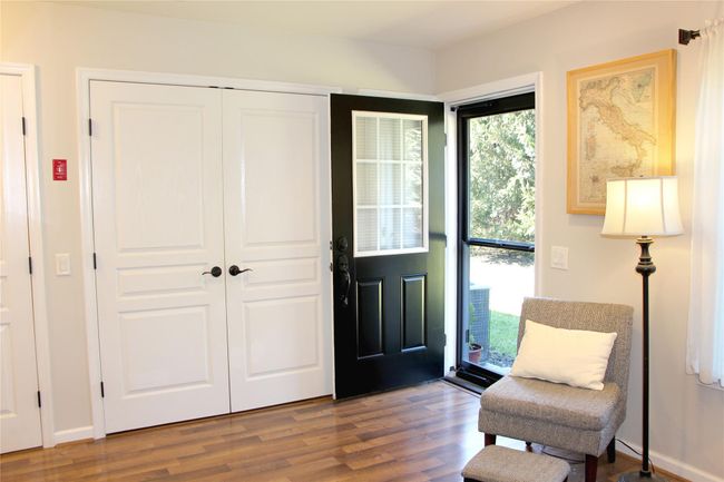 Entrance foyer with baseboards and wood finished floors | Image 17