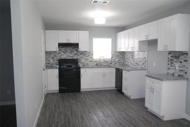 Check out this beautifully remodeled kitchen with brand new appliances and easy close doors and drawers! | Image 8