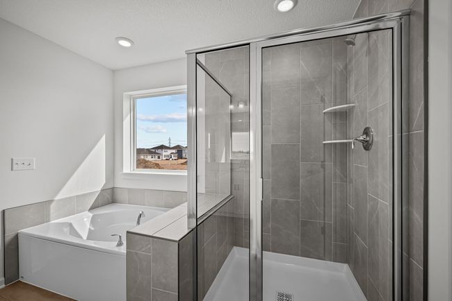 Owners Suite Bath complete with soaking tub and glass encased shower. | Image 13
