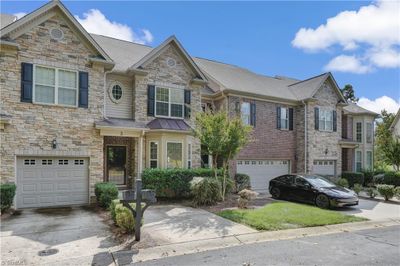 Notice the great attention to detail from the bay window accented by stone facade and covered front porch. | Image 3