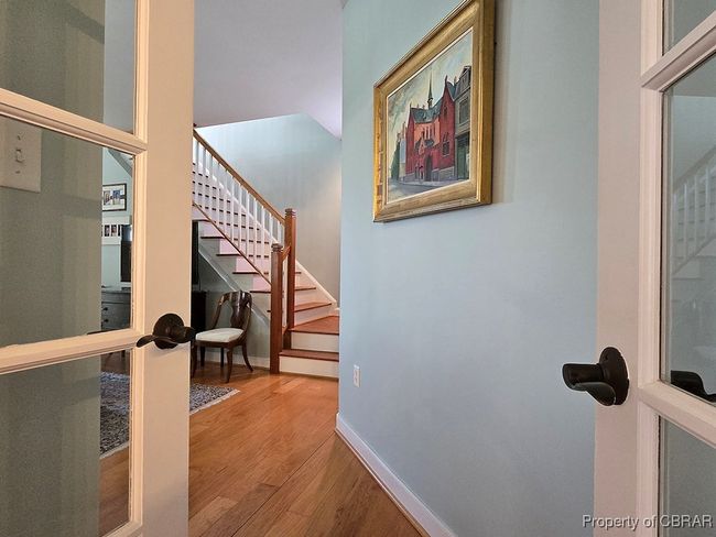 Stairway with wood finished floors and baseboards | Image 27