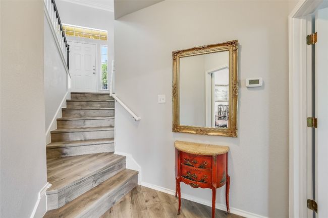 A few steps down to 2 more primary suites | Image 24