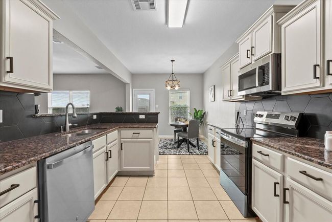 Discover the joy of cooking in this well-appointed kitchen, where every meal is an opportunity to connect and create. | Image 14