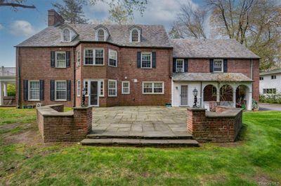 Rear view of house with a patio and a lawn | Image 3