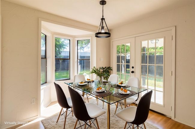 Dining room featuring light wood finished floors and french doors | Image 10