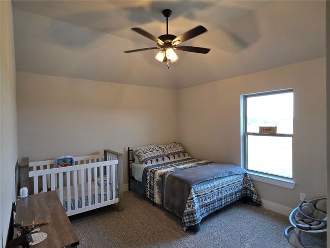 Bedroom featuring carpet flooring and a ceiling fan | Image 33
