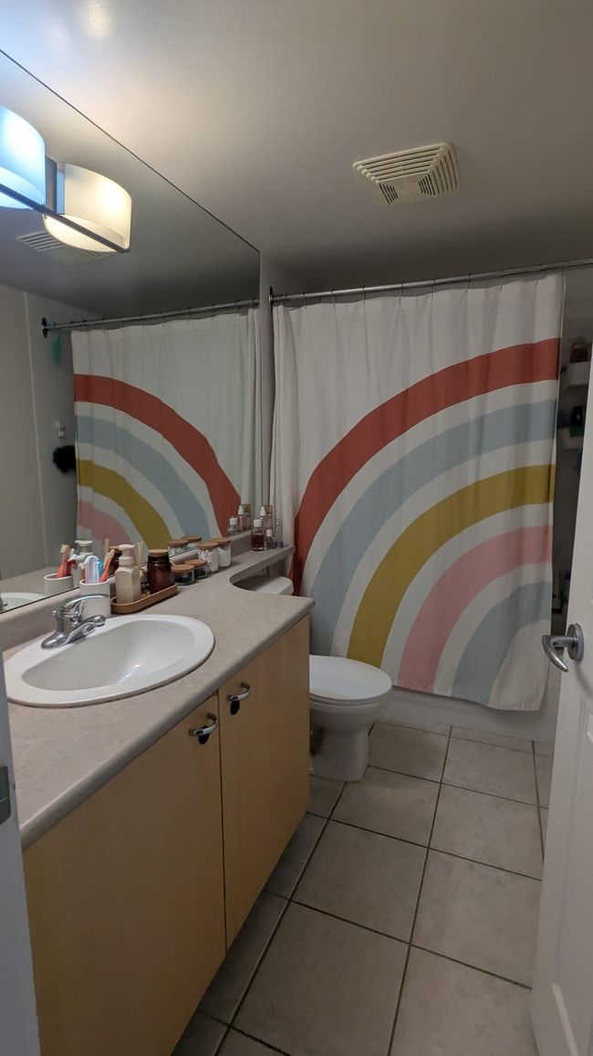 Full bathroom featuring toilet, visible vents, vanity, and tile patterned flooring | Image 17