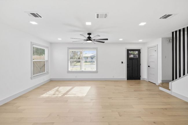 There are many options on how you could place your furniture in this large living room. | Image 7