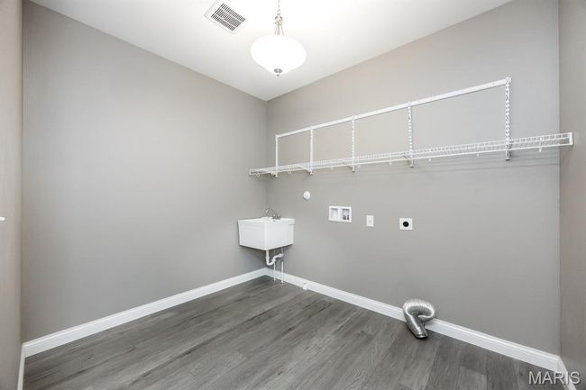 Washer and electric dryer hookups, utility sink and LVP flooring | Image 22