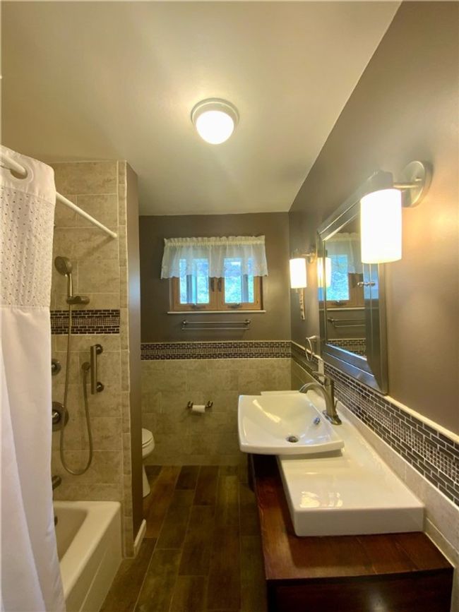 Updated bath on main level | Image 16