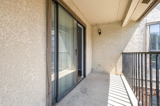 Roomy balcony overlooks the pool | Image 15