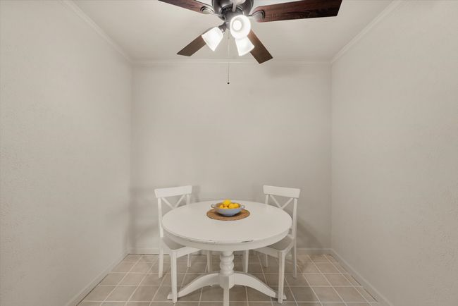 Tiled dining area with crown molding | Image 17