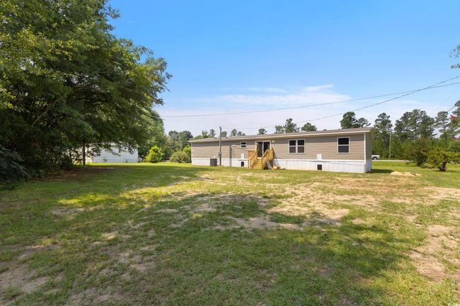 Back of property featuring a yard | Image 33