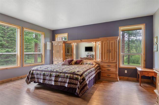 Bedroom featuring light wood-style flooring and baseboards | Image 41