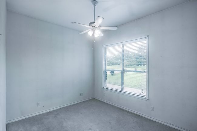 Spare room featuring a ceiling fan and carpet | Image 12