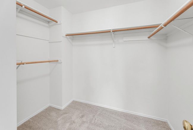 Spacious closet with carpet floors | Image 20