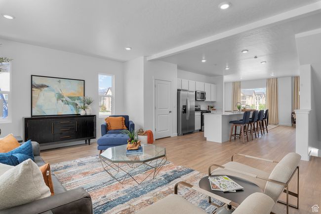 Living room with light wood-style floors and recessed lighting | Image 5