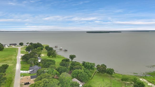 Aerial view of property's location with a large body of water | Image 7