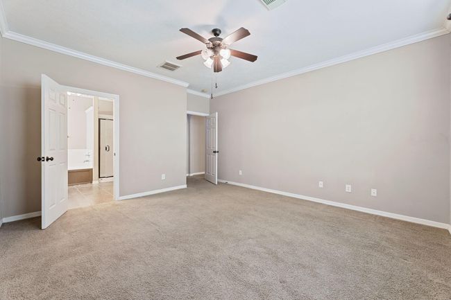 Primary bedroom with ceiling fan | Image 22