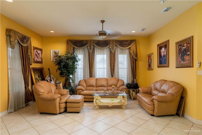 Tiled living room featuring ceiling fan | Image 10
