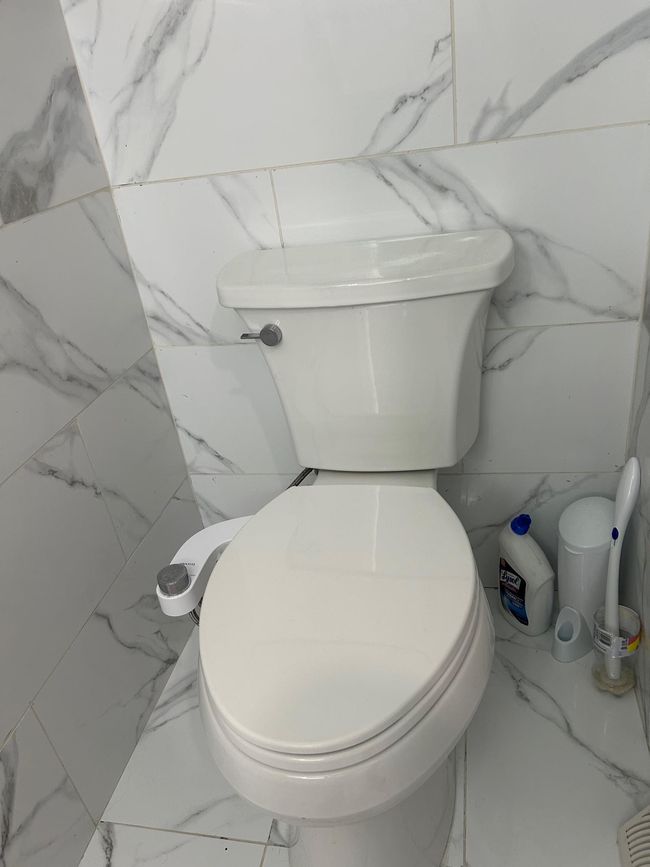 Bathroom featuring toilet and marble look tile flooring | Image 31