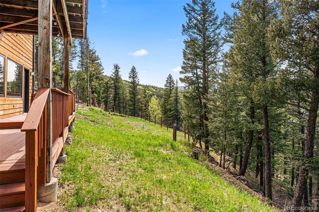 Partially fenced yard area | Image 37