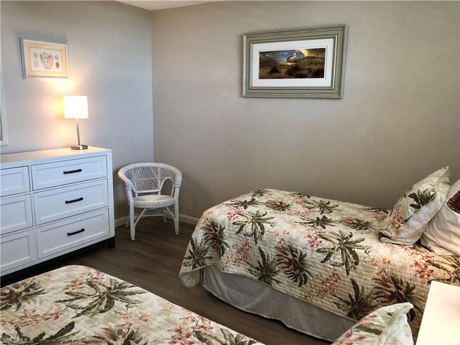 Bedroom featuring dark wood-type flooring and baseboards | Image 17