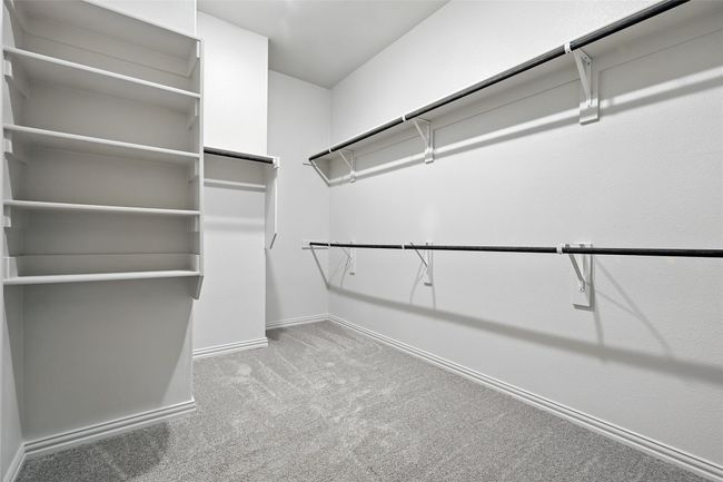 Spacious closet featuring carpet floors | Image 24